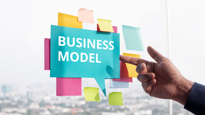 handing pointing to Business Model sign