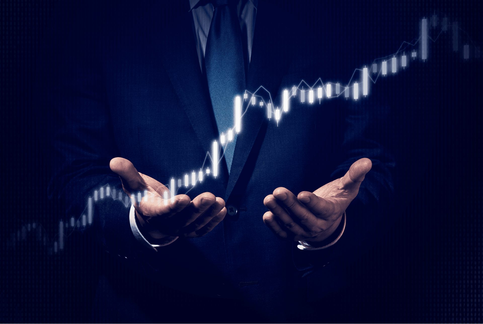 mans hands in business suit holding a graph climbing up